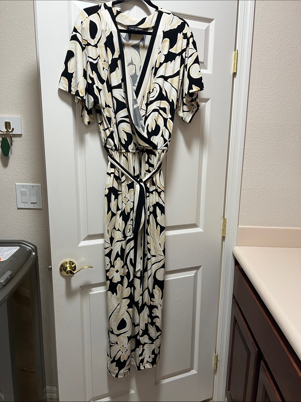 Lane Bryant Black and Cream Floral Wrap Jumpsuit